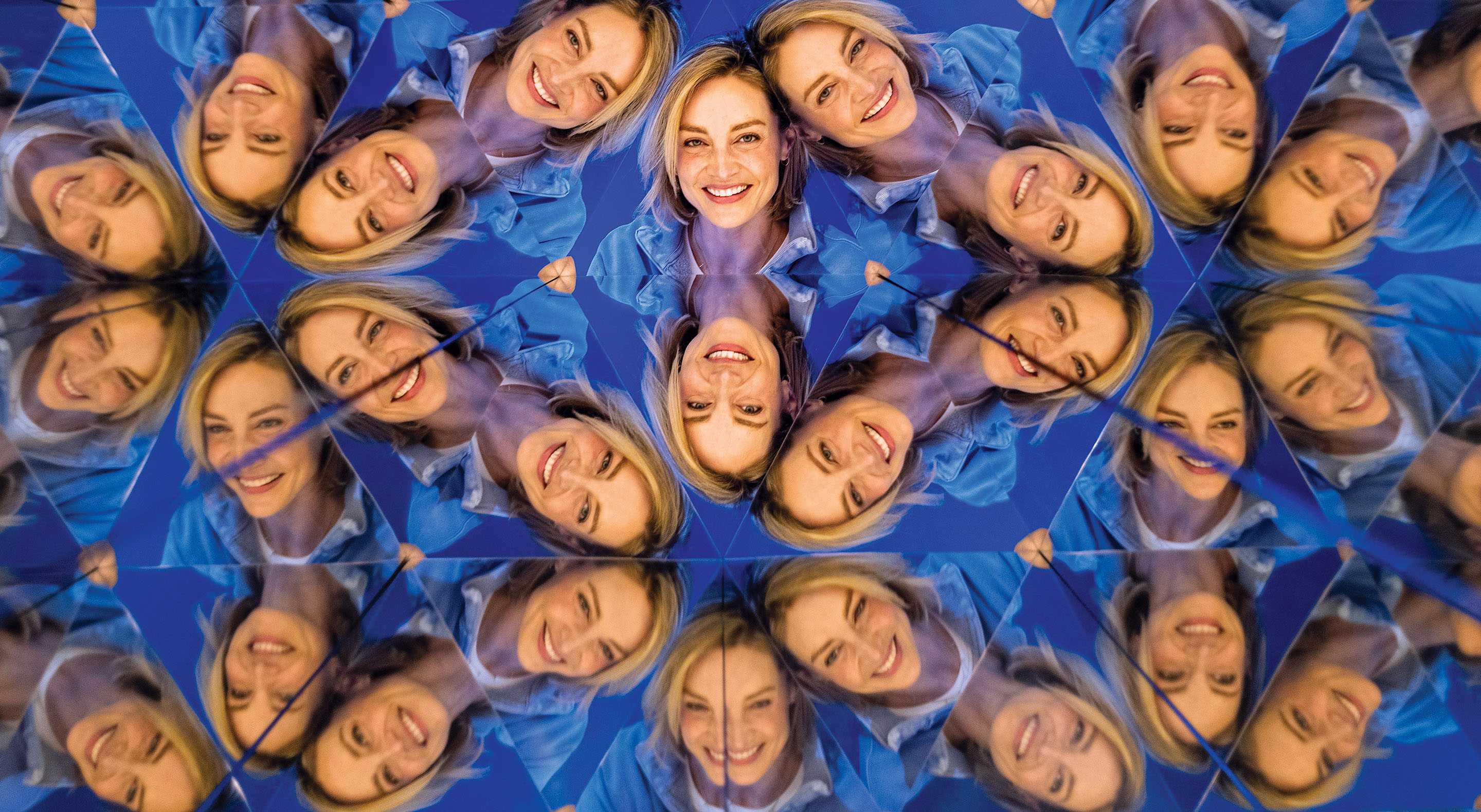 A woman's face is multiplied at the Museum of Illusions' Kaleidoscope exhibit.